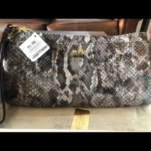 Embossed python Coach clutch